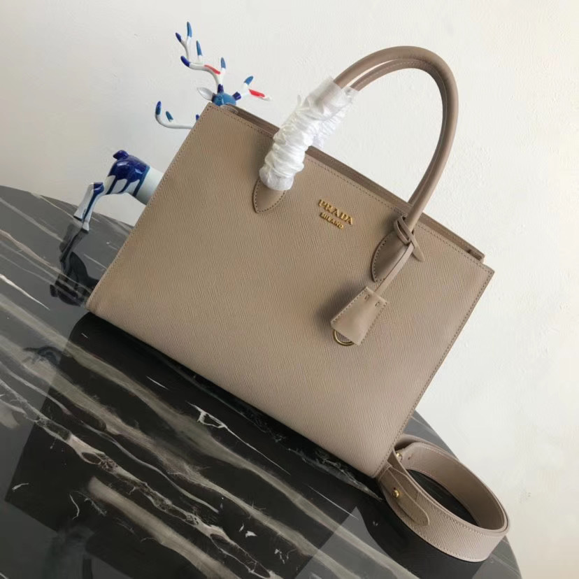 Prada Saffiano leather Bibliotheque tote bag in a beige or nude color