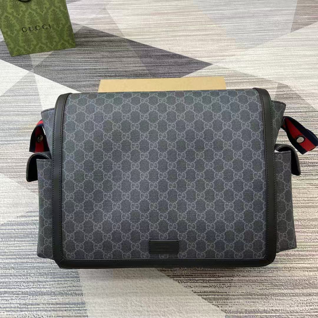 Gucci medium diaper bag in black/grey GG Supreme canvas with red and blue Web strap