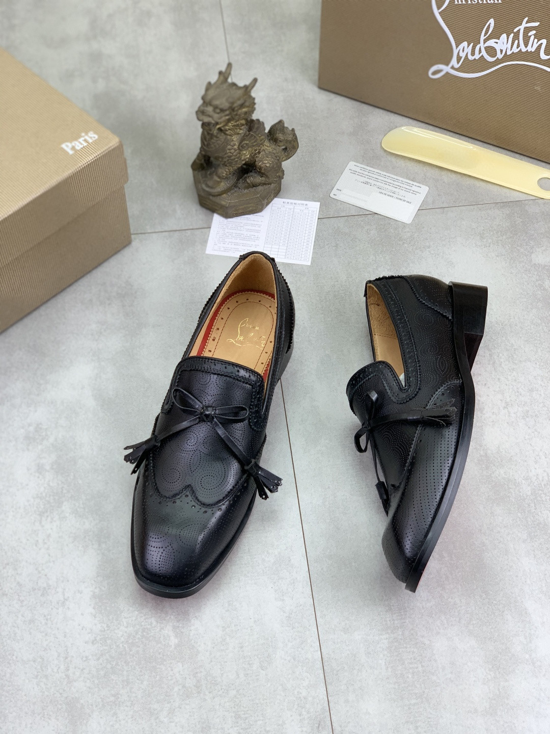 Christian Louboutin Grave Moc loafers in black calf leather and patinated Havane brown calf leather