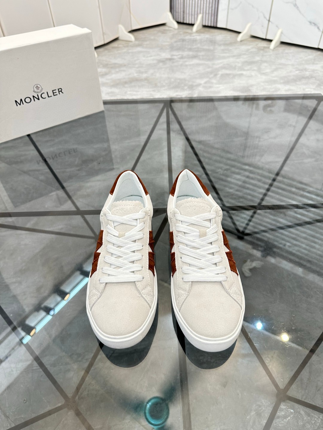 Moncler Monaco or Monaco 2 low top sneakers in grey suede with a burgundy or maroon "M" logo detail on the side and heel tab