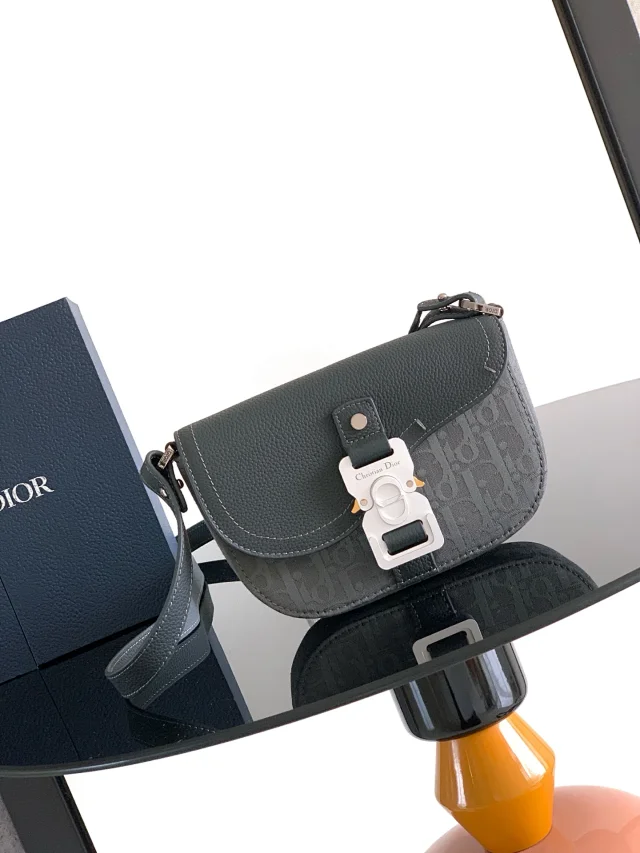 Dior saddle clutch with a shoulder strap