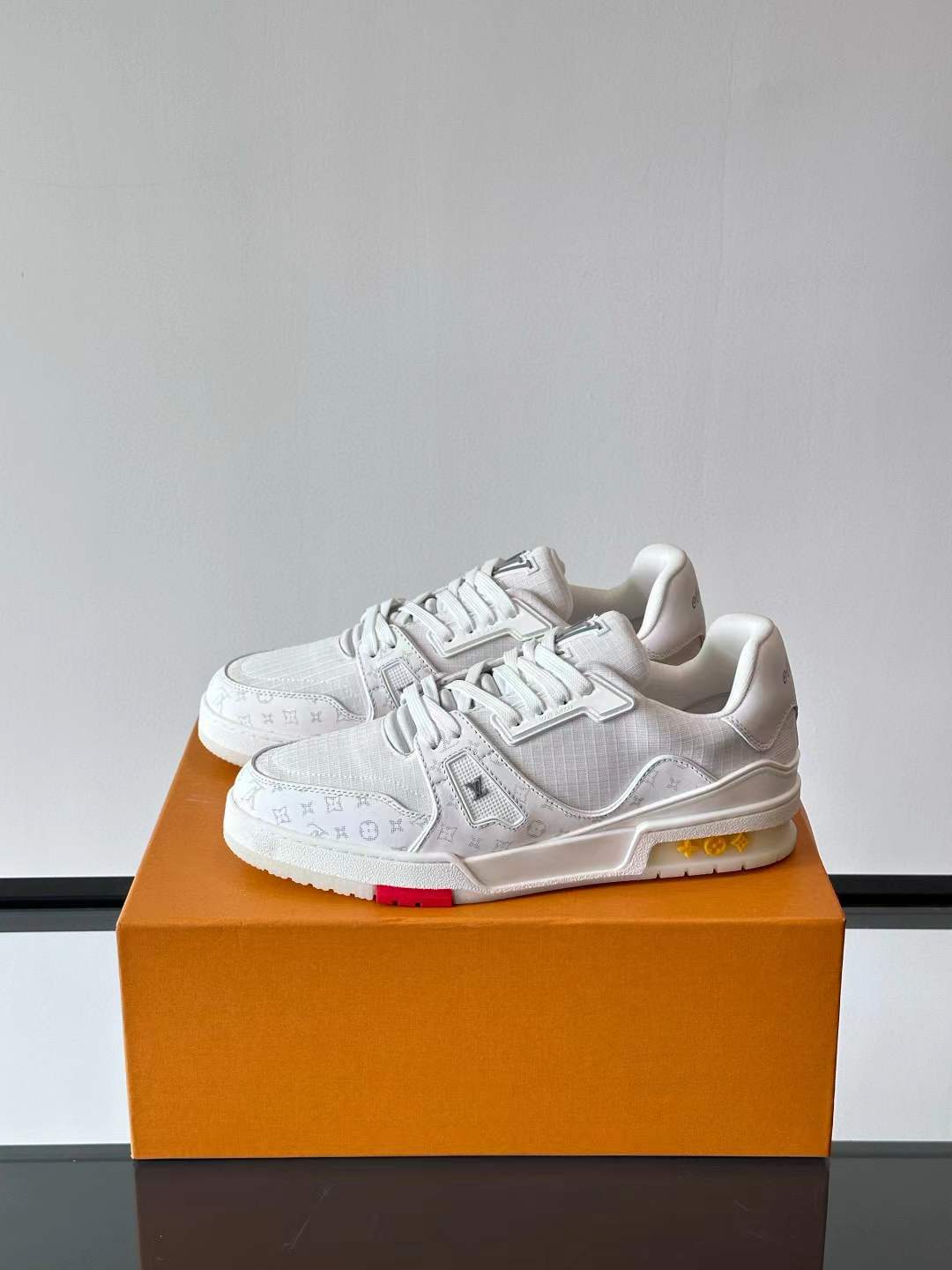 LV Trainer sneakers in white smooth and grained calf leather