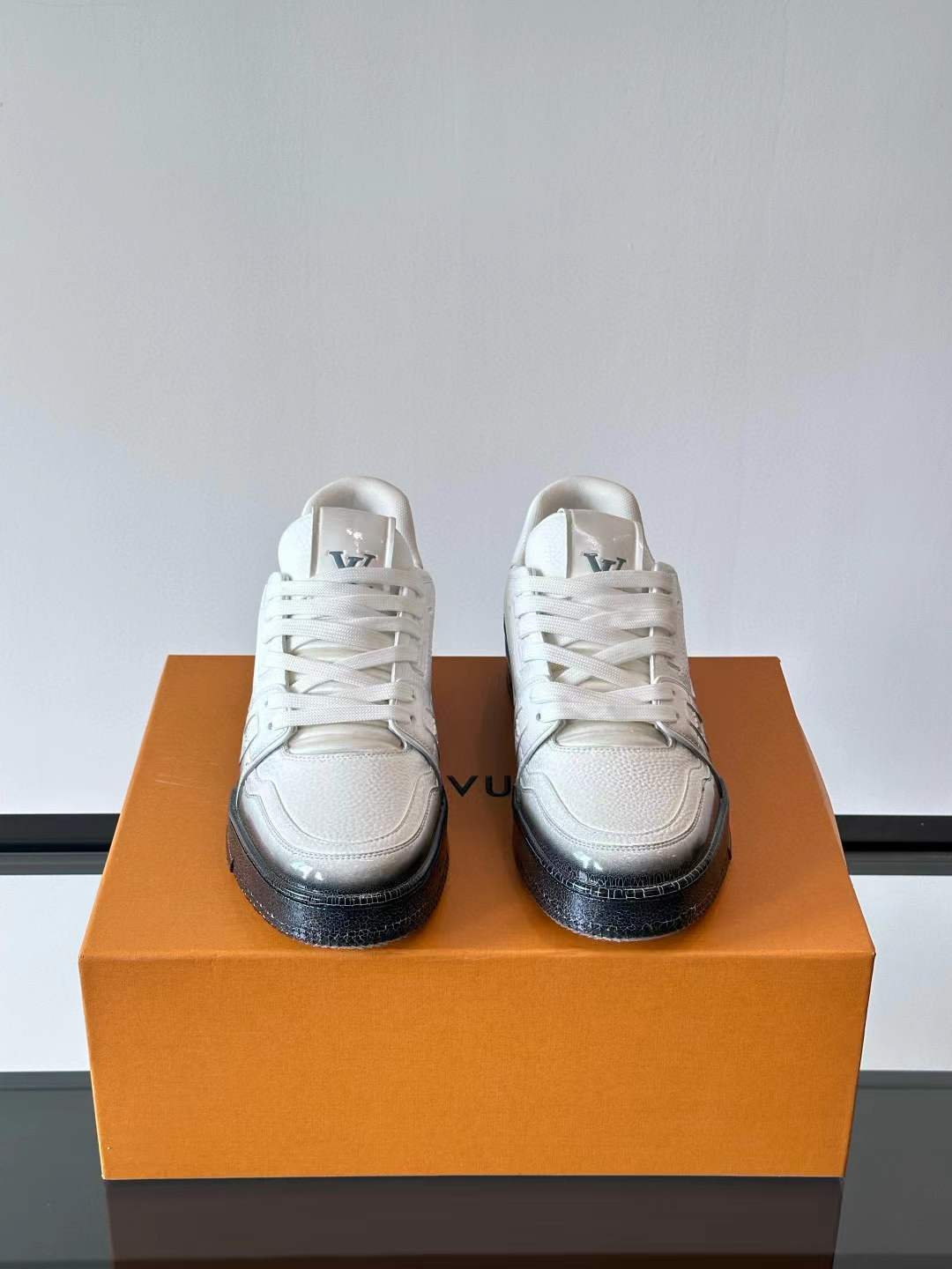 LV Trainer Maxi sneaker with a white upper and a black chunky sole