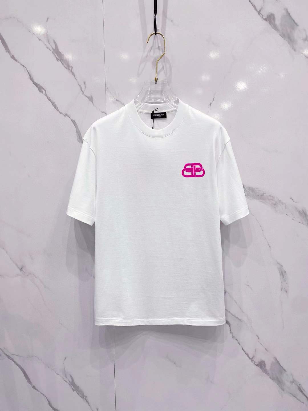 balecinaga white crew neck t-shirt with a pink Balenciaga logo
