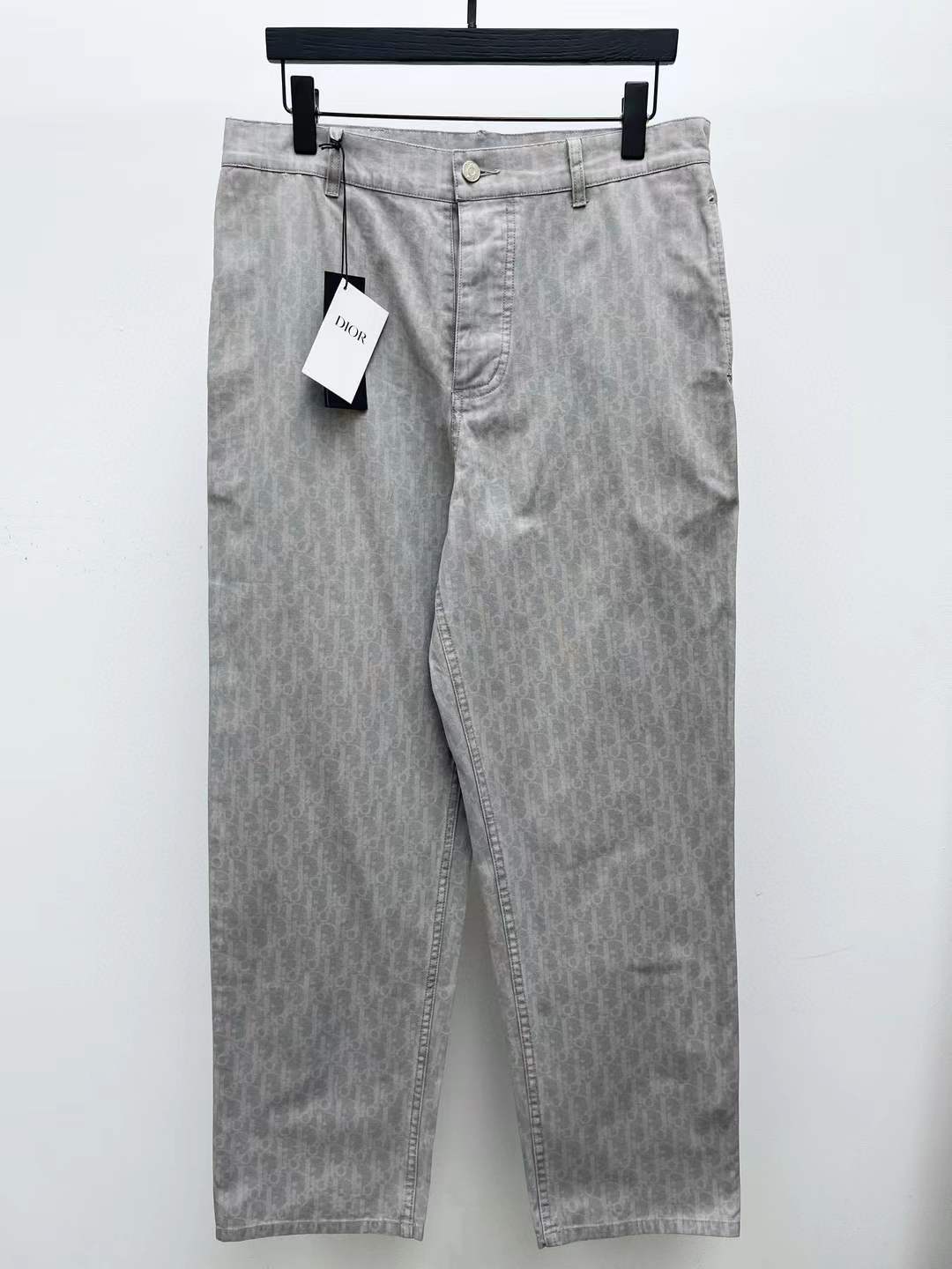 Dior men's wide-cut pants in grey with a magnified version of the Dior Oblique motif, likely from the Dior Denim line