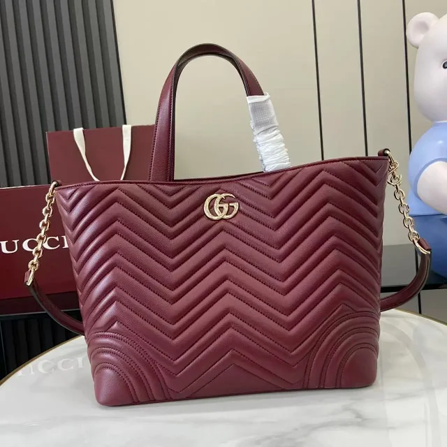 Gucci GG Marmont Matelassé tote bag in a deep red or burgundy color