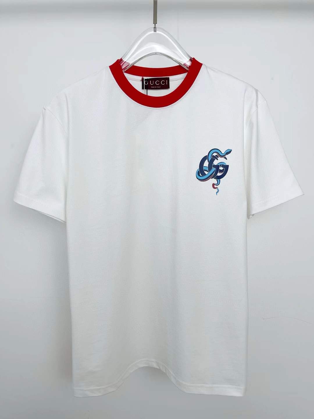 Gucci T-shirt with a red ringer neck and a blue snake graphic on the chest