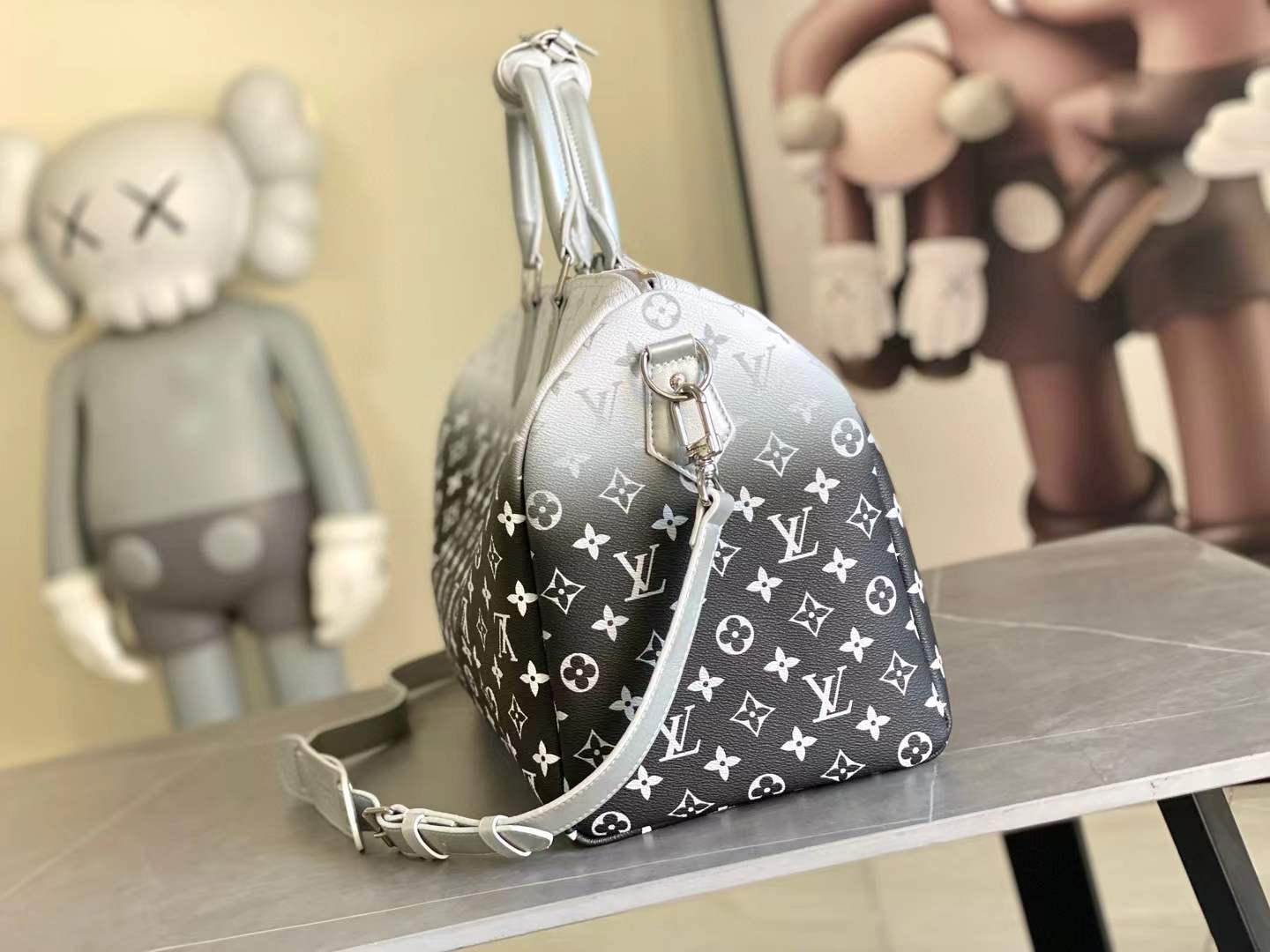 LV Keepall Bandoulière 45 travel bag in the Aquagarden Monogram canvas with a silver-tone gradient finish