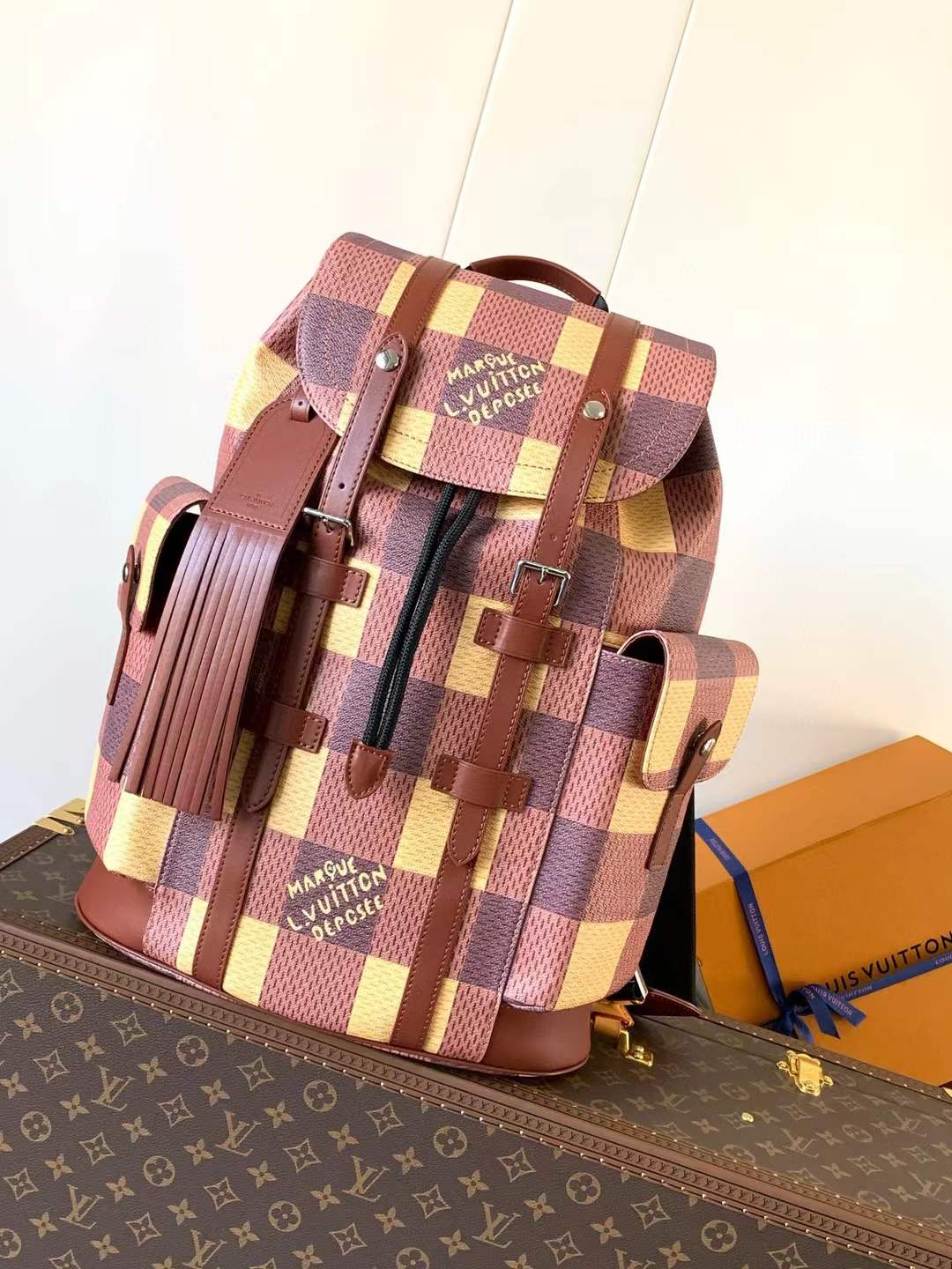 LV Christopher backpack in a limited edition multi-colored checkered pattern, part of the Pharrell Williams collection