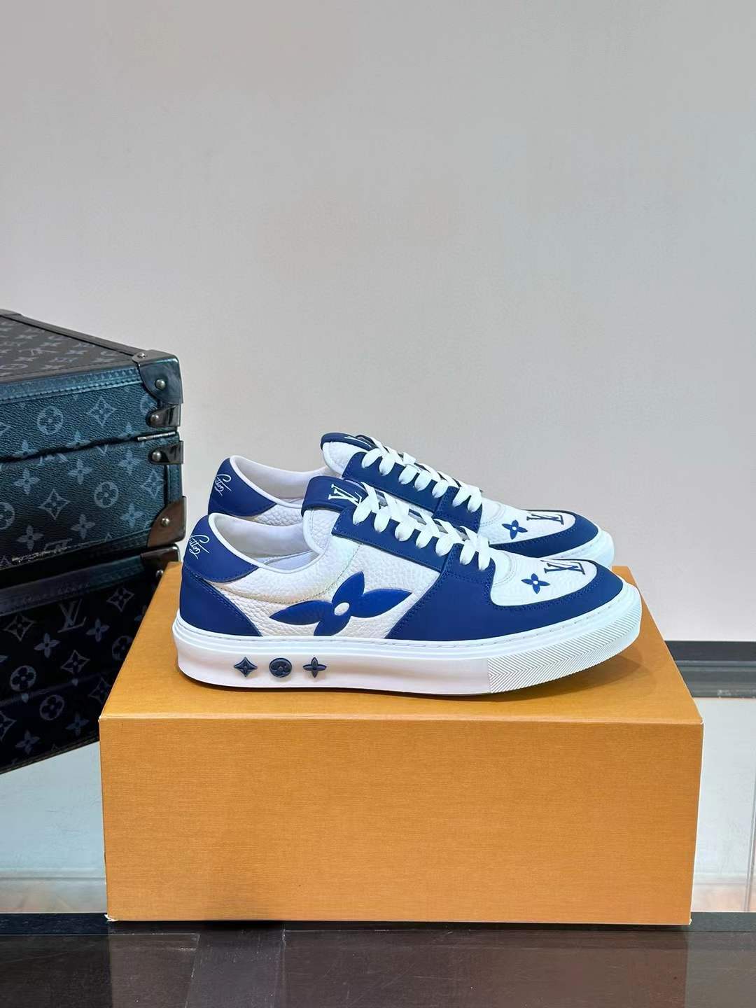 LV Charlie sneaker in blue and white, crafted from monogram denim and monogram-embossed grained calf leather
