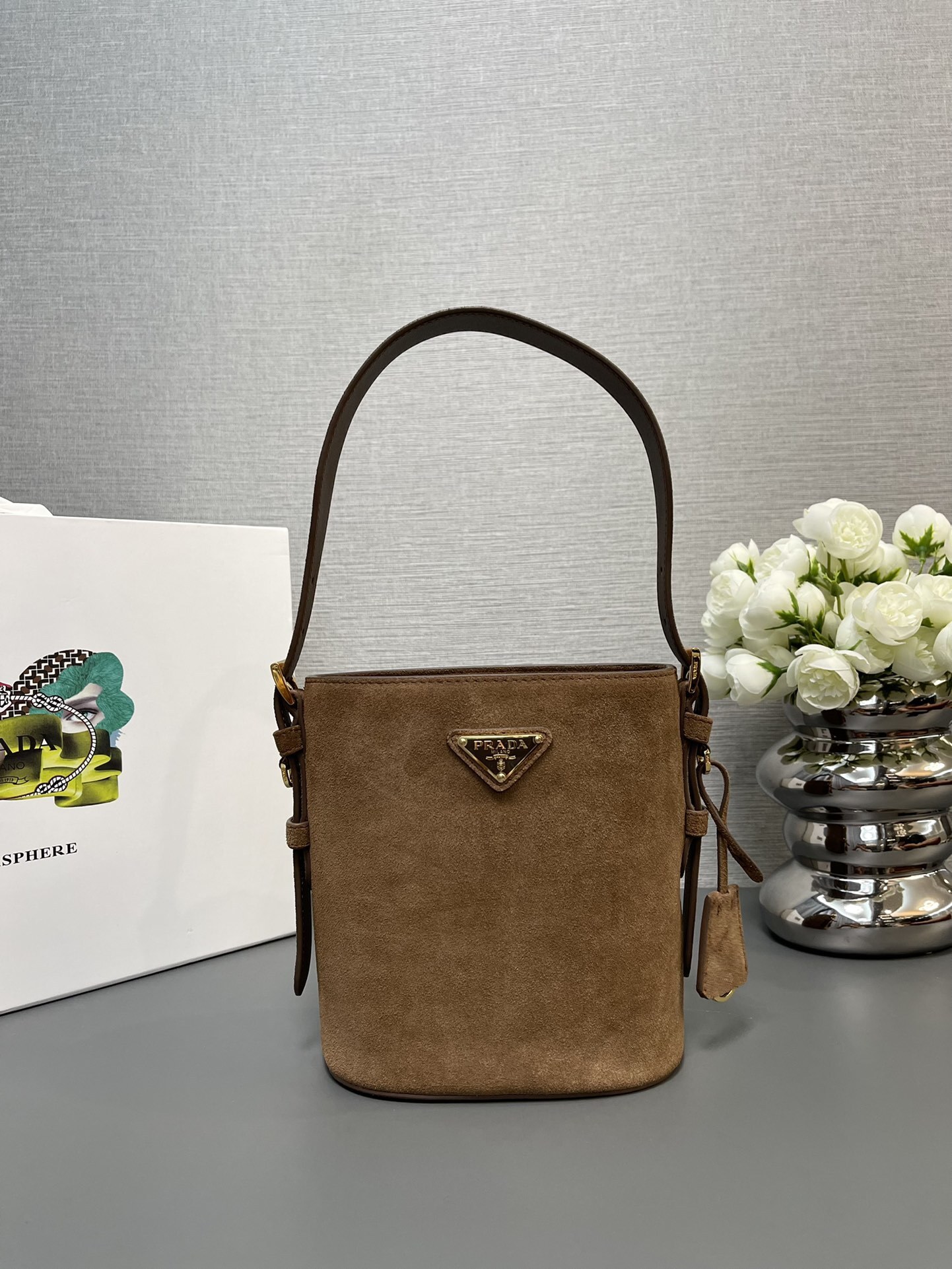 Prada Mini suede bucket bag in the cinnamon color