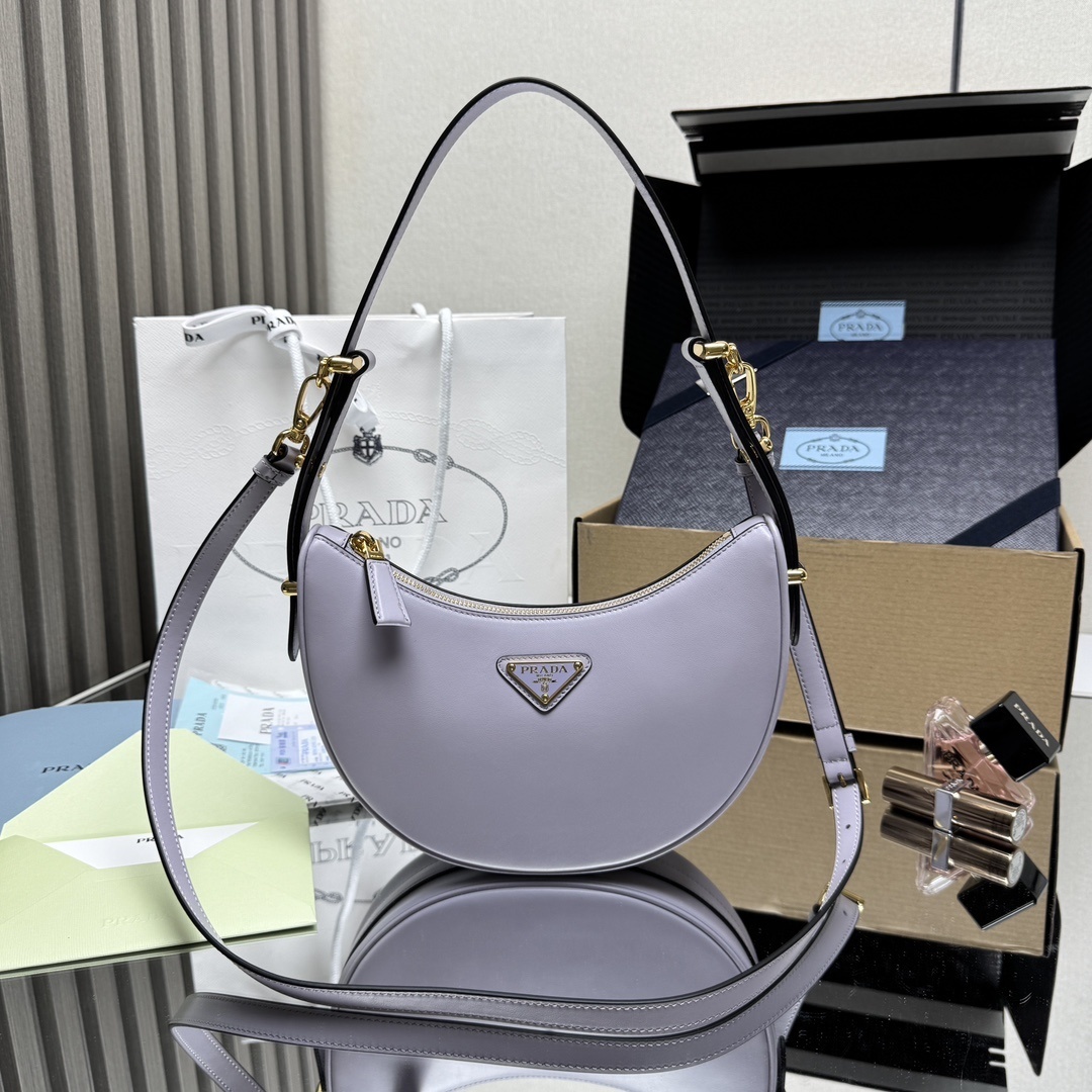 Prada Arqué leather shoulder bag in a light purple/lilac color