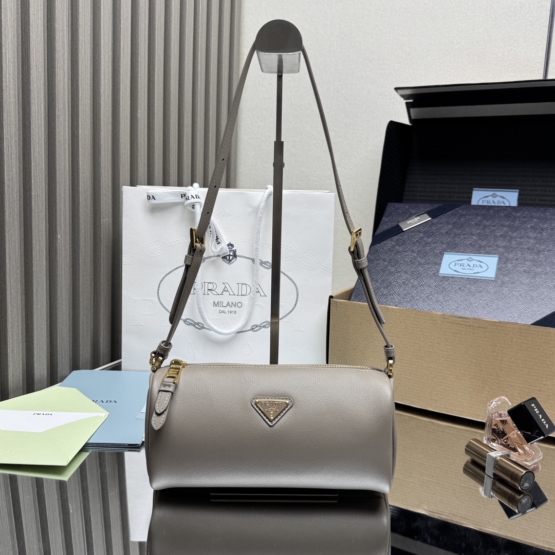 Prada leather shoulder bag in a taupe-grey color