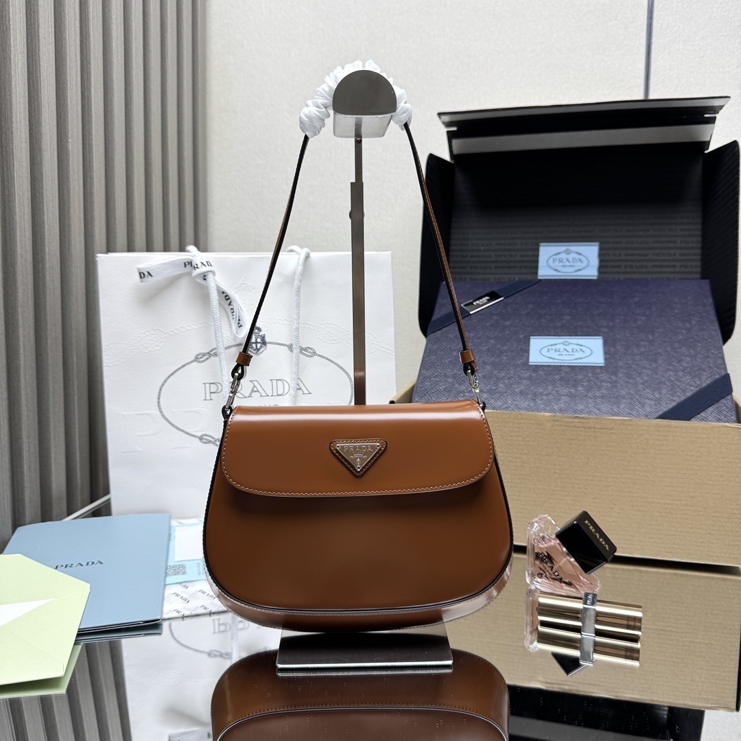 Prada Cleo Brushed Leather Shoulder Bag with Flap in a brown hue