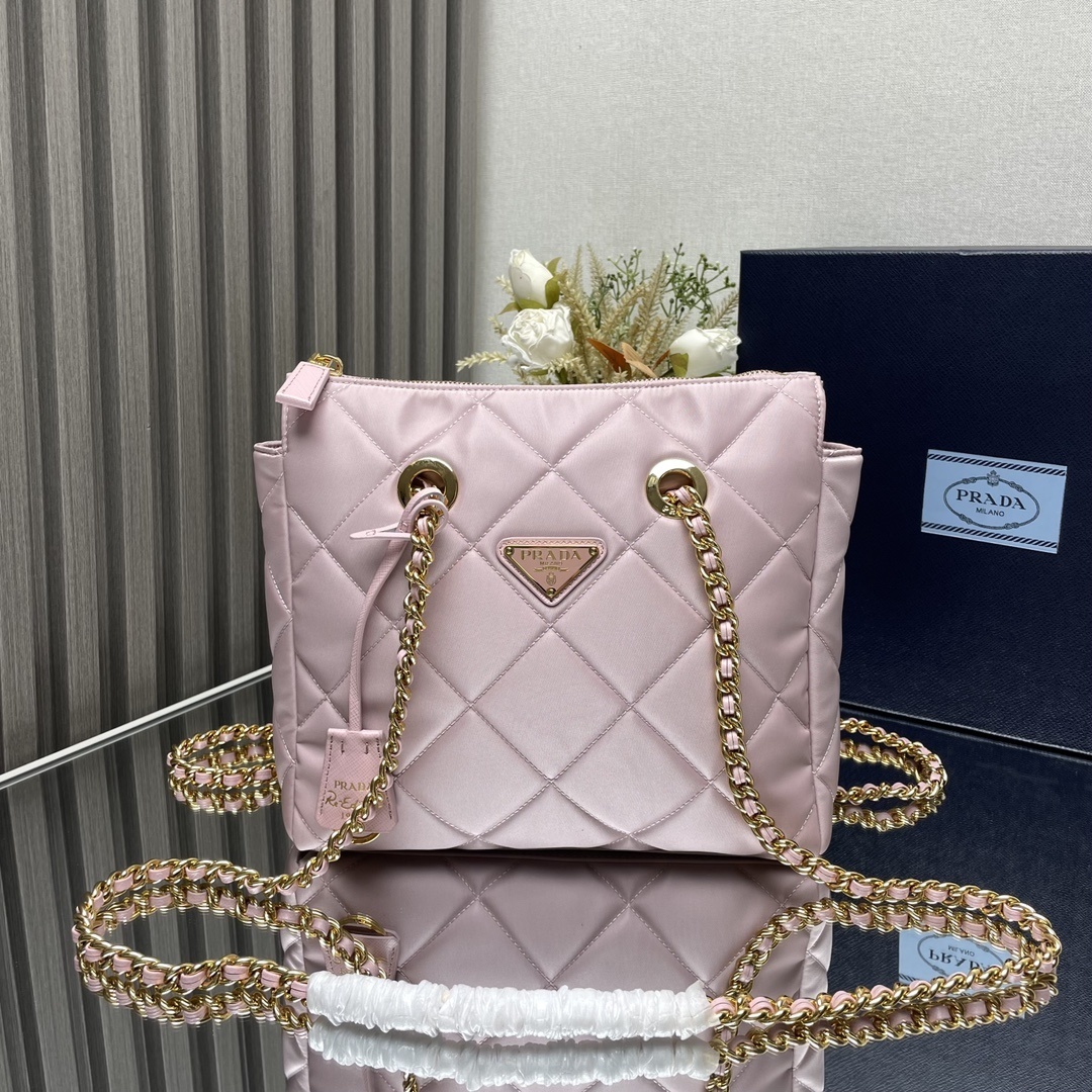 Prada padded nylon tote bag in pink with gold-tone chain shoulder straps and the iconic triangle logo plaque