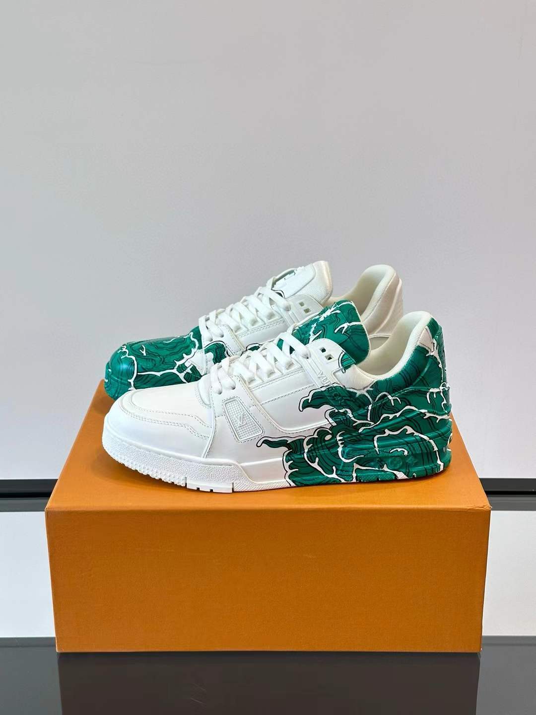 LV low-top Trainer sneaker with a green and white artistic design