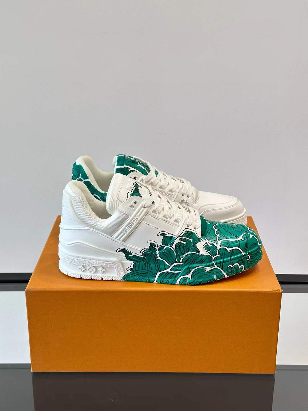 LV low-top Trainer sneaker with a green and white artistic design