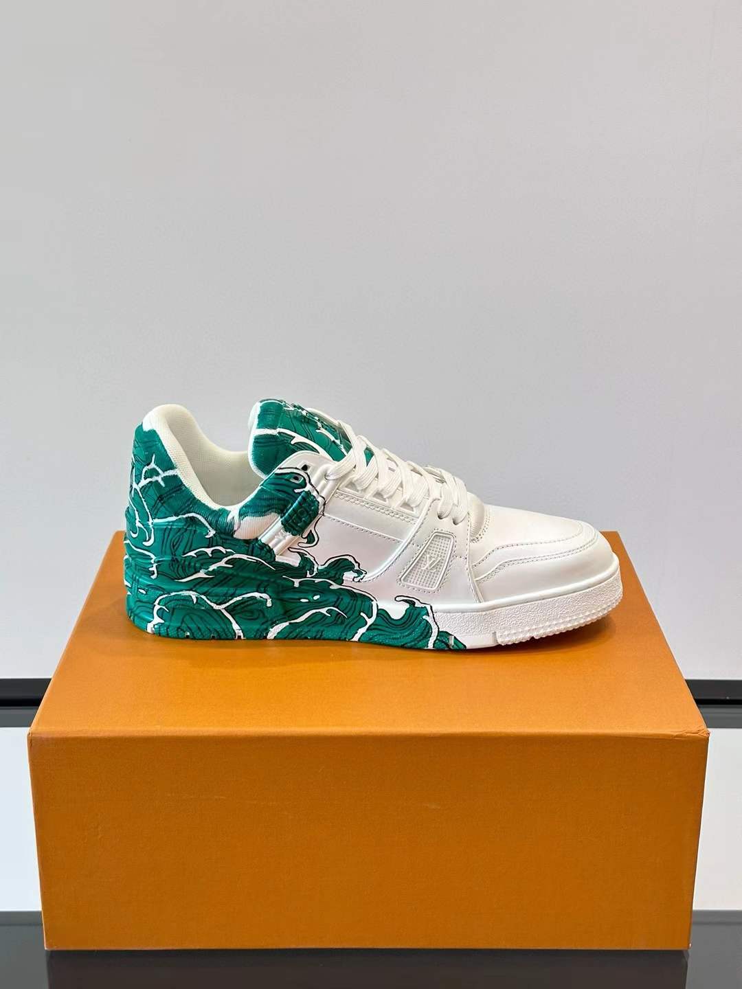 LV low-top Trainer sneaker with a green and white artistic design