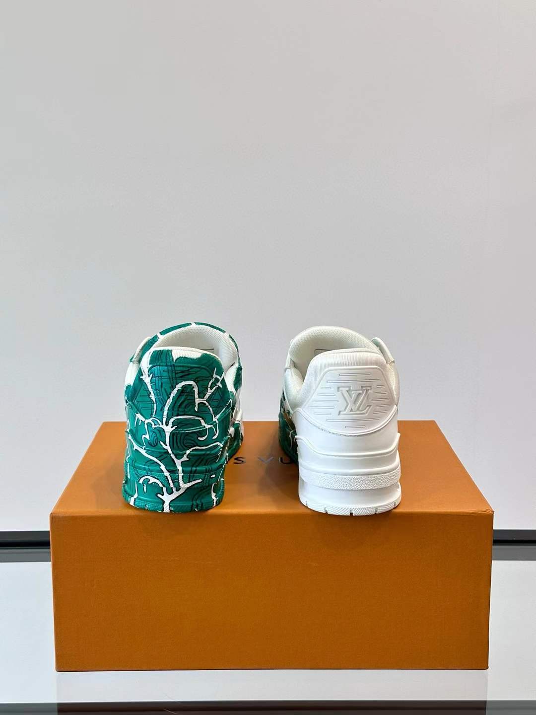 LV low-top Trainer sneaker with a green and white artistic design