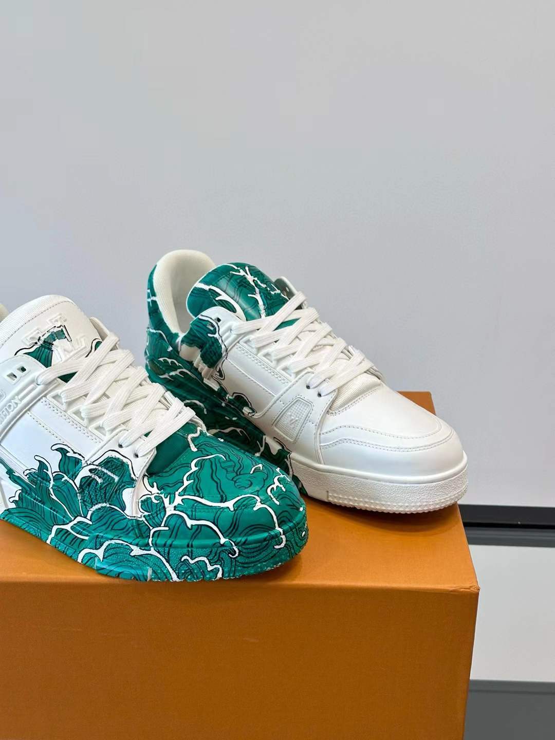 LV low-top Trainer sneaker with a green and white artistic design