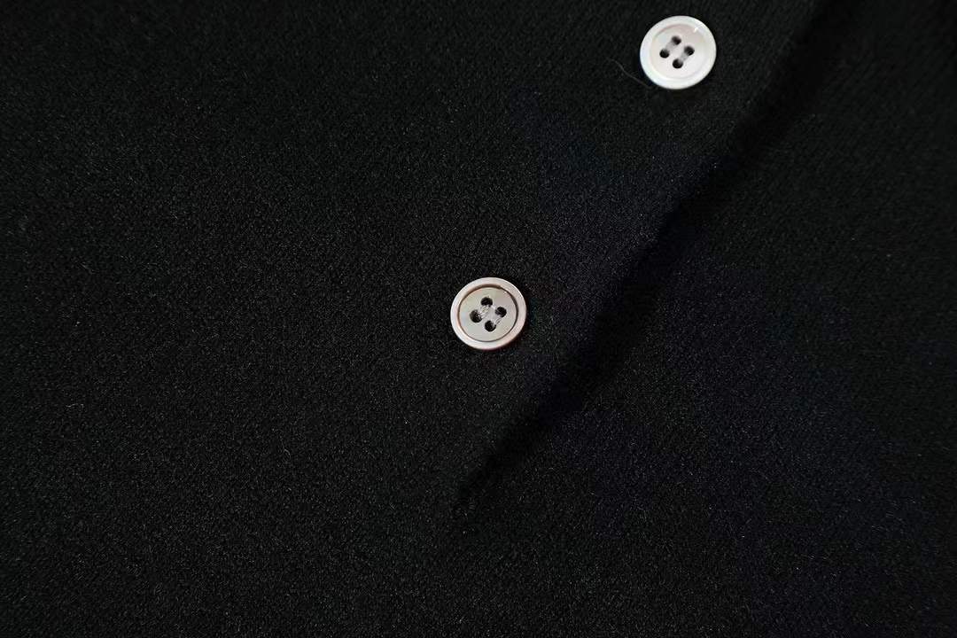 Miu Miu virgin wool long-sleeved polo sweater in black