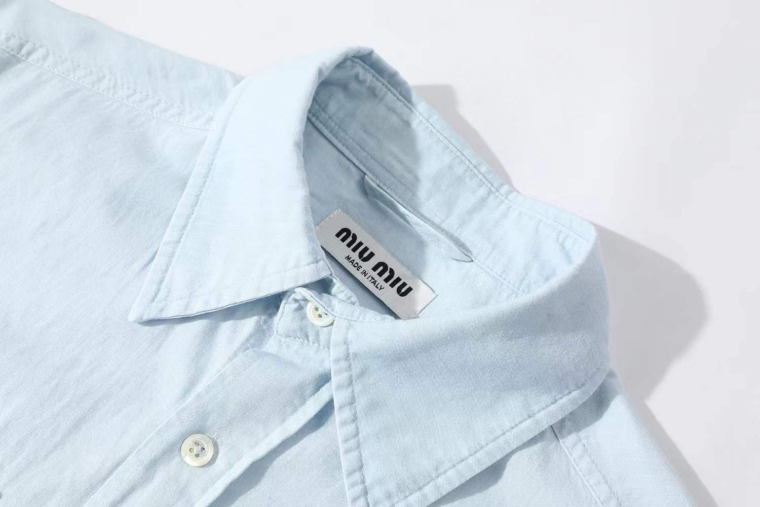 Miu Miu light blue chambray shirt in cotton with a logo patch