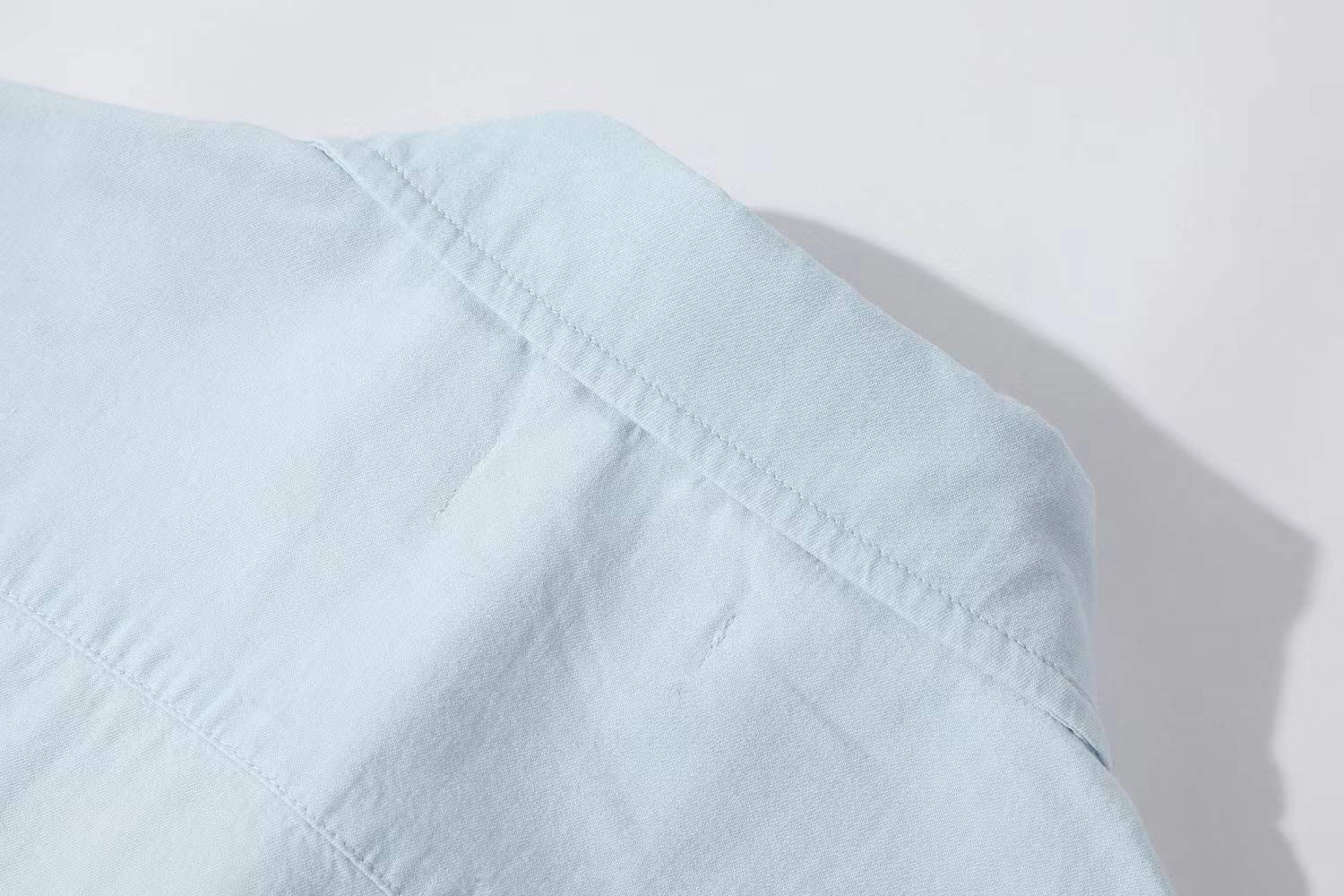 Miu Miu light blue chambray shirt in cotton with a logo patch