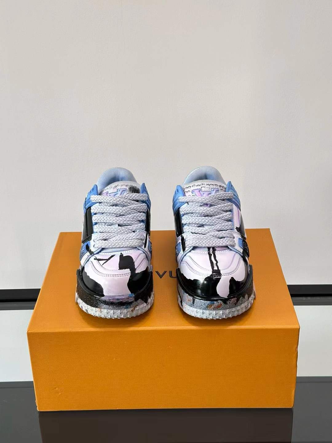 LV Trainer sneakers with a custom "paint splatter" design