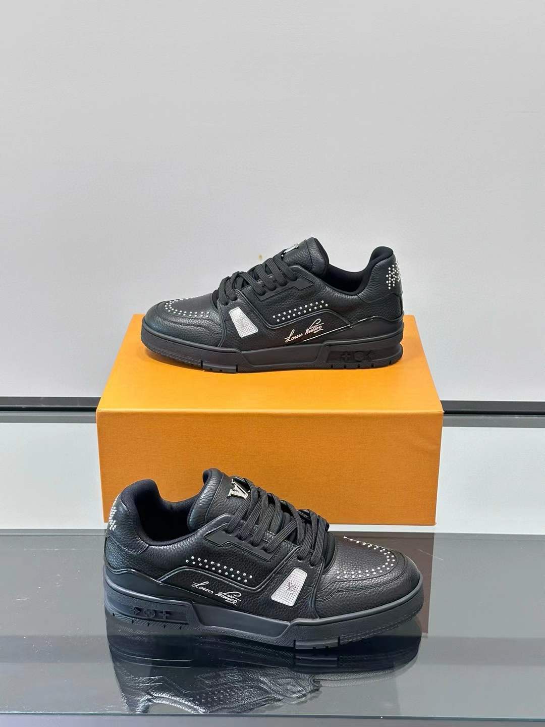 LV Trainer sneaker in black calf leather.