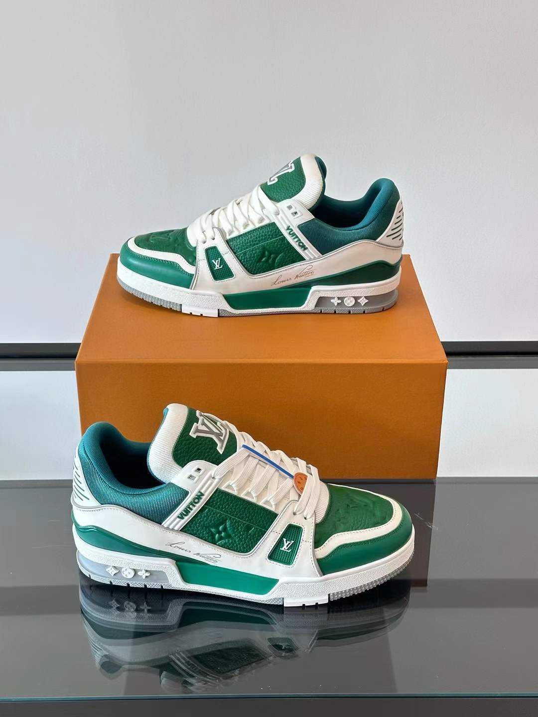 LV Trainer sneaker in a green and white colorway