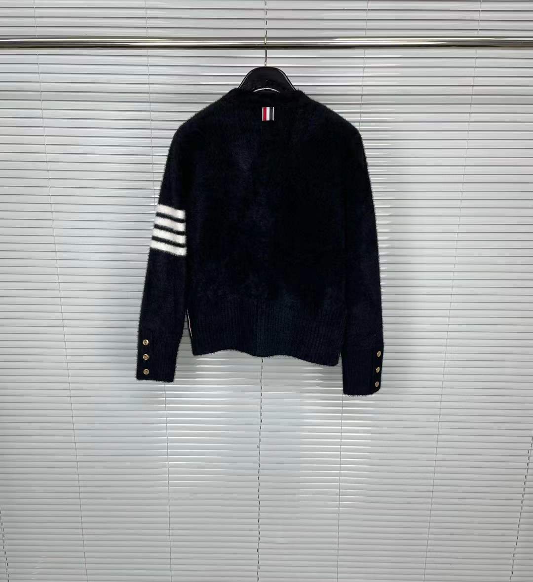 Thom Browne navy blue cotton V-neck cardigan featuring the signature 4-Bar stripe on the sleeve and the Hector motif.