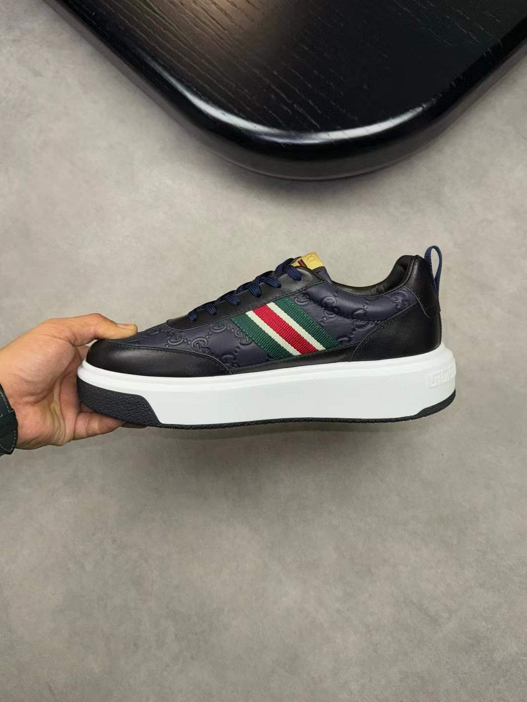 Gucci Screener sneaker in blue and dark blue GG Supreme canvas with blue and red web stripe and dark blue leather
