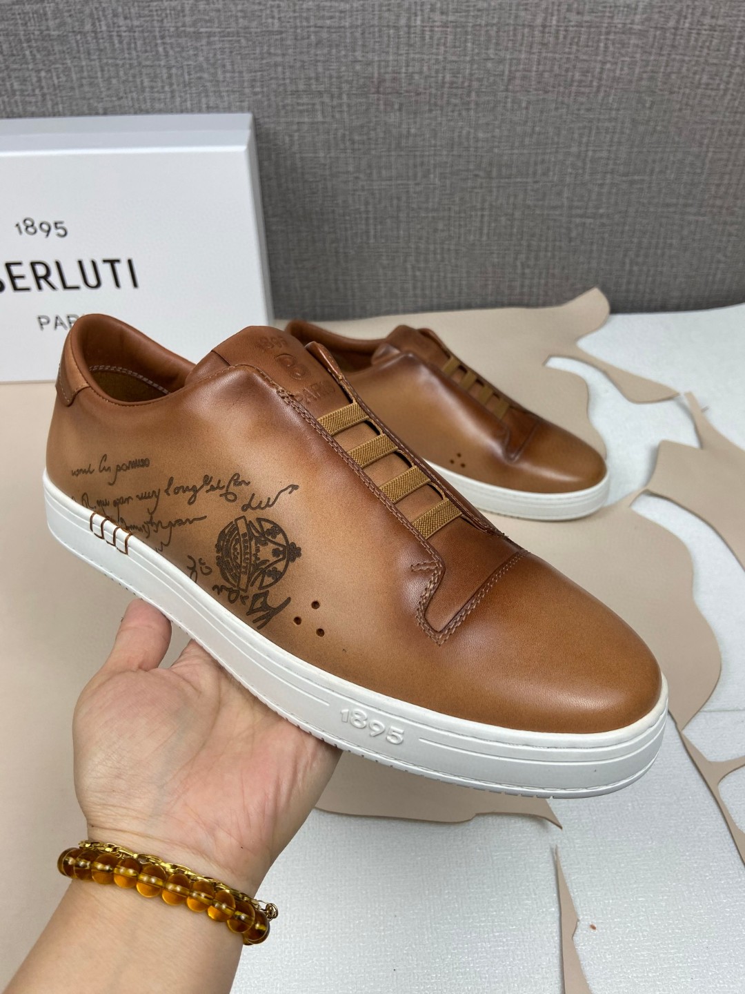 Berluti Playtime slip-on sneaker in brown Venezia leather with Scritto calligraphy