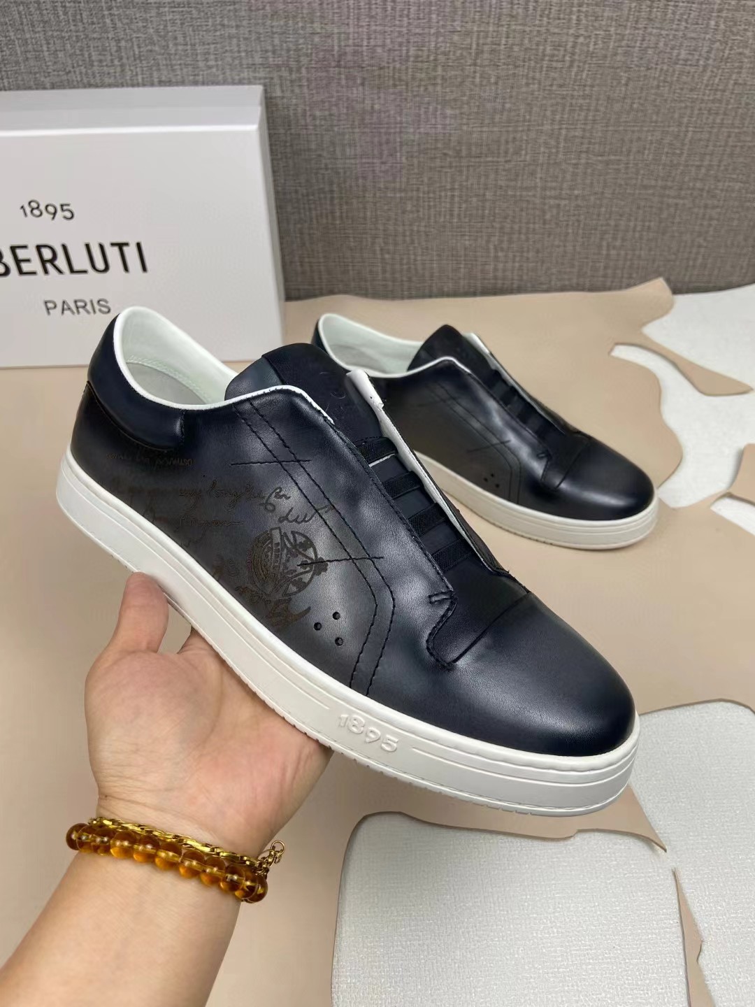 Berluti Playtime Scritto Venezia leather slip-on sneakers in black