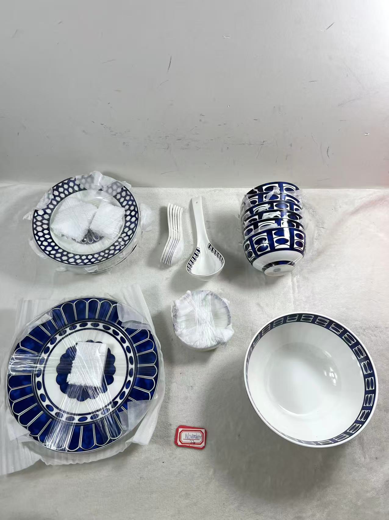 Hermes blue and white ceramic dinnerware with a Moroccan-inspired pattern