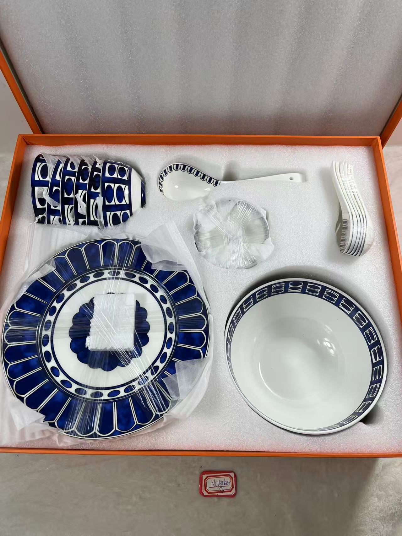 Hermes blue and white ceramic dinnerware with a Moroccan-inspired pattern