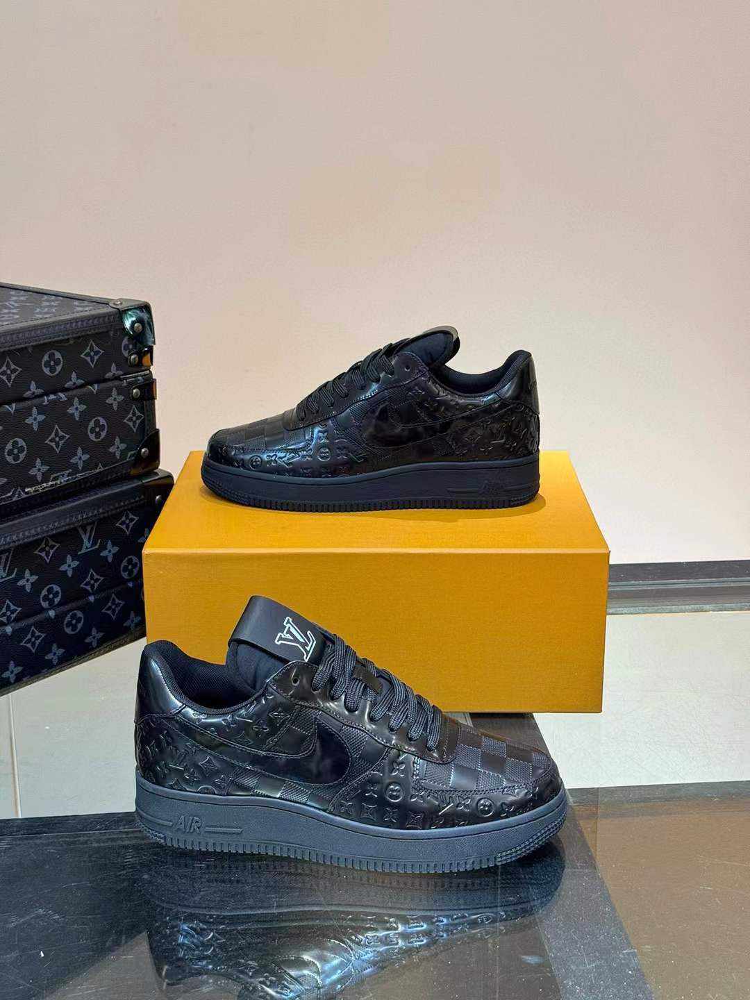LV x Nike Air Force 1 Low sneakers in black with the iconic monogram pattern stamped into the leather