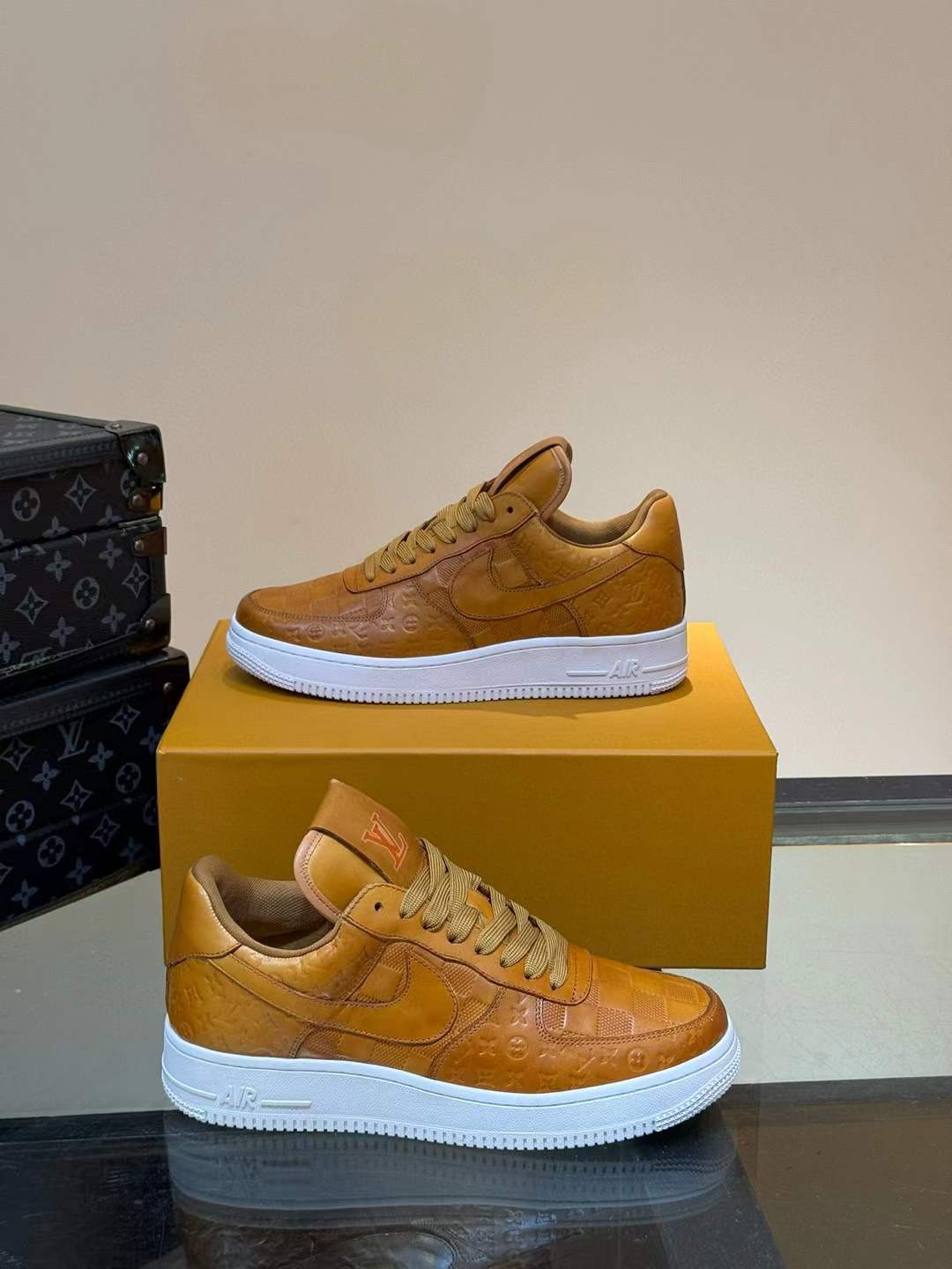 LV Air Force 1 '07 in a "Flax" or "Wheat" colorway boot inspired details a soft leather upper, and a white rubber sole.