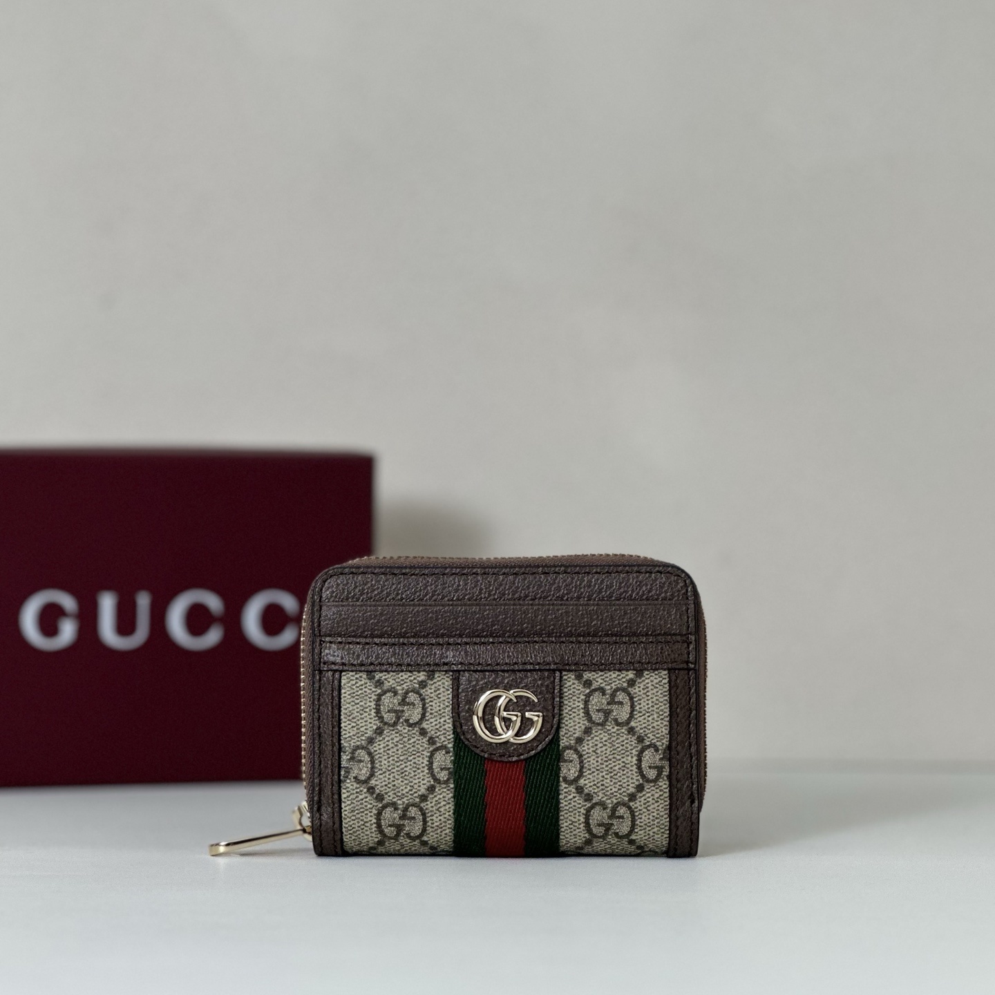 Gucci Ophidia card case in beige and ebony GG Supreme canvas with brown leather trim and the green and red Web stripe.