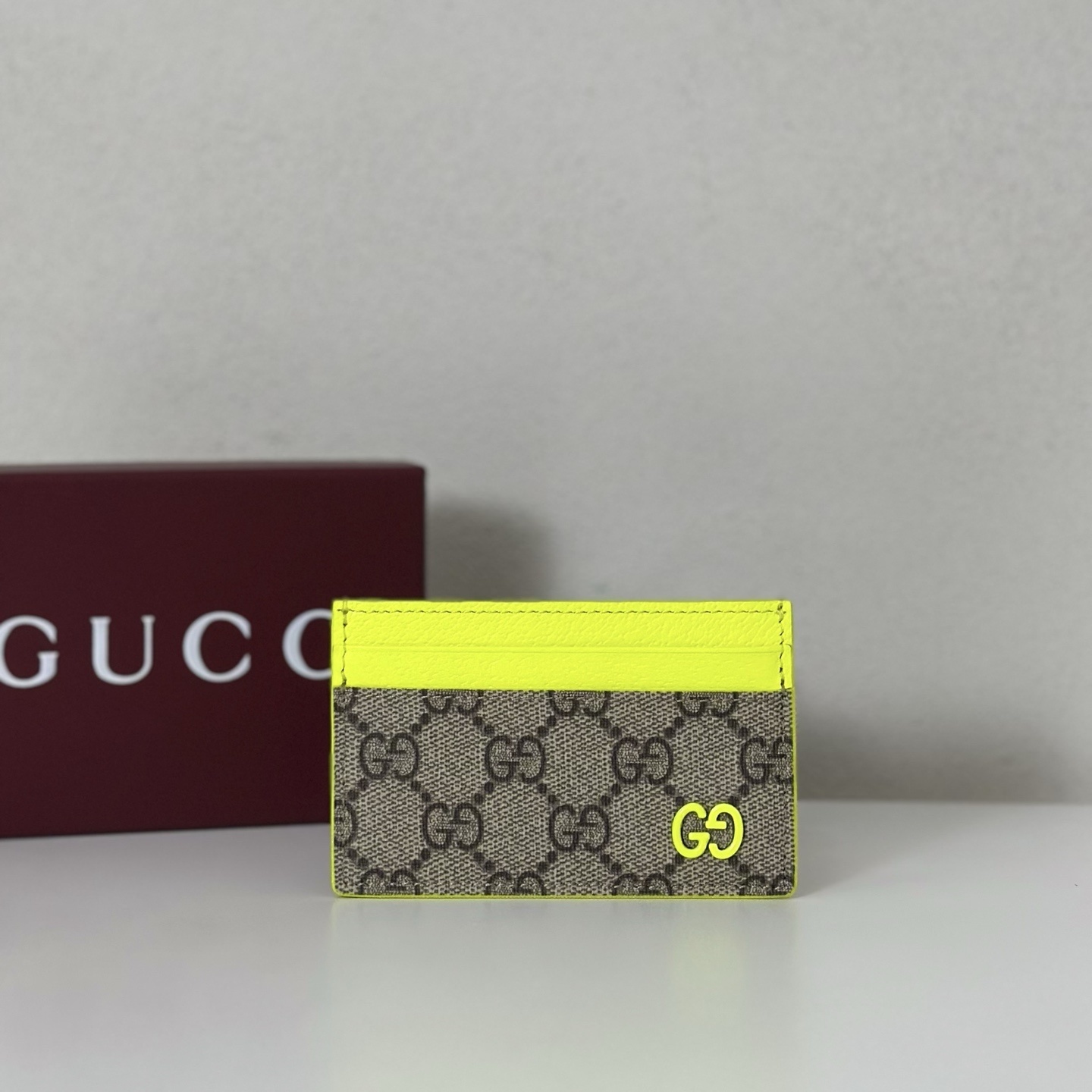 Gucci GG canvas card holder in brown with neon yellow leather trims