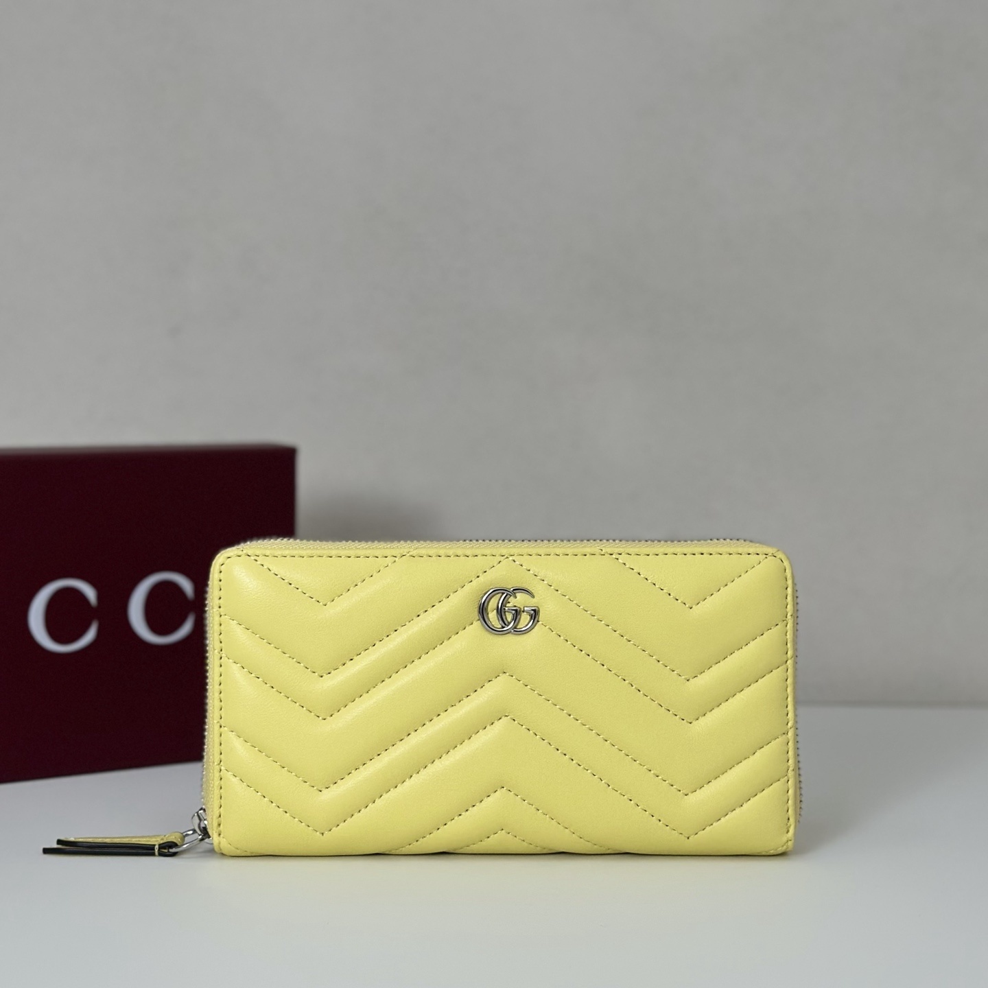 Gucci GG Marmont zip-around wallet in yellow matelassé chevron leather with silver-tone hardware