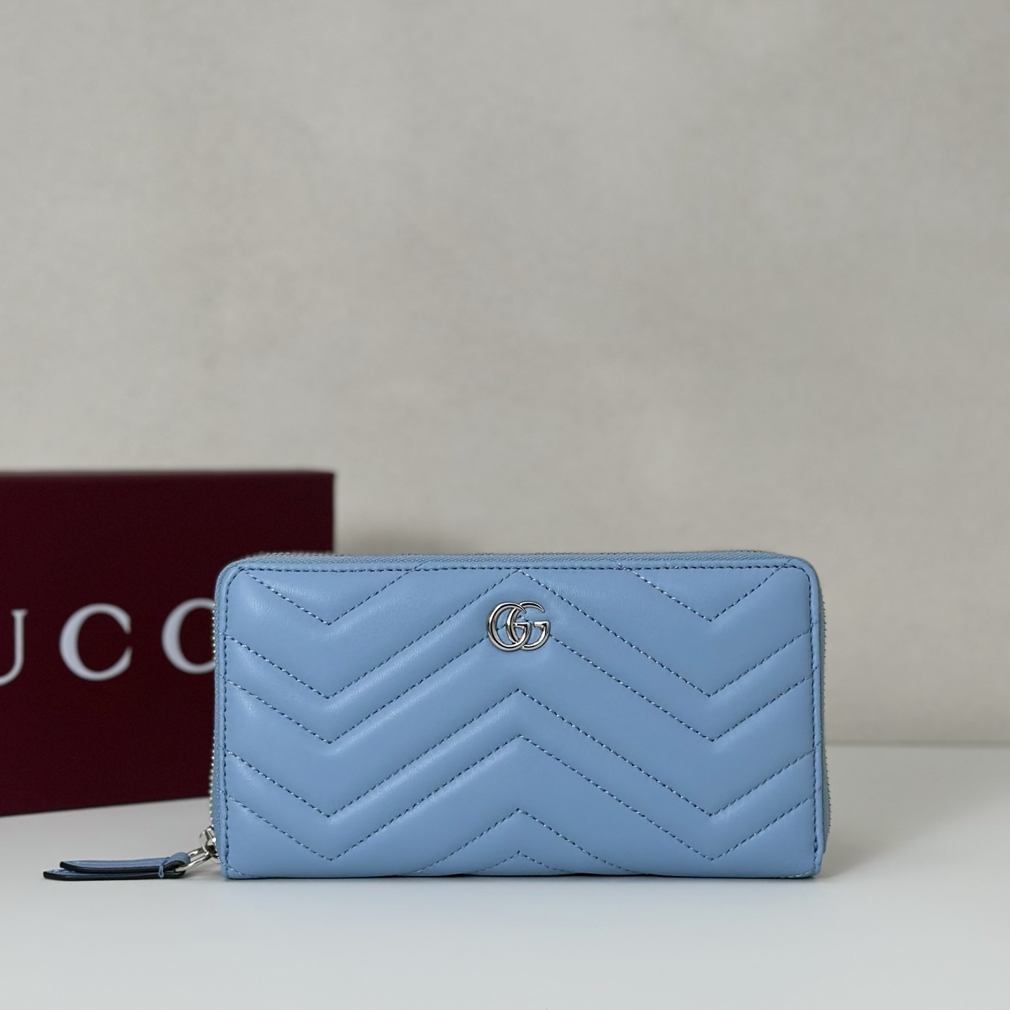 Gucci GG Marmont zip-around wallet in light blue matelassé leather