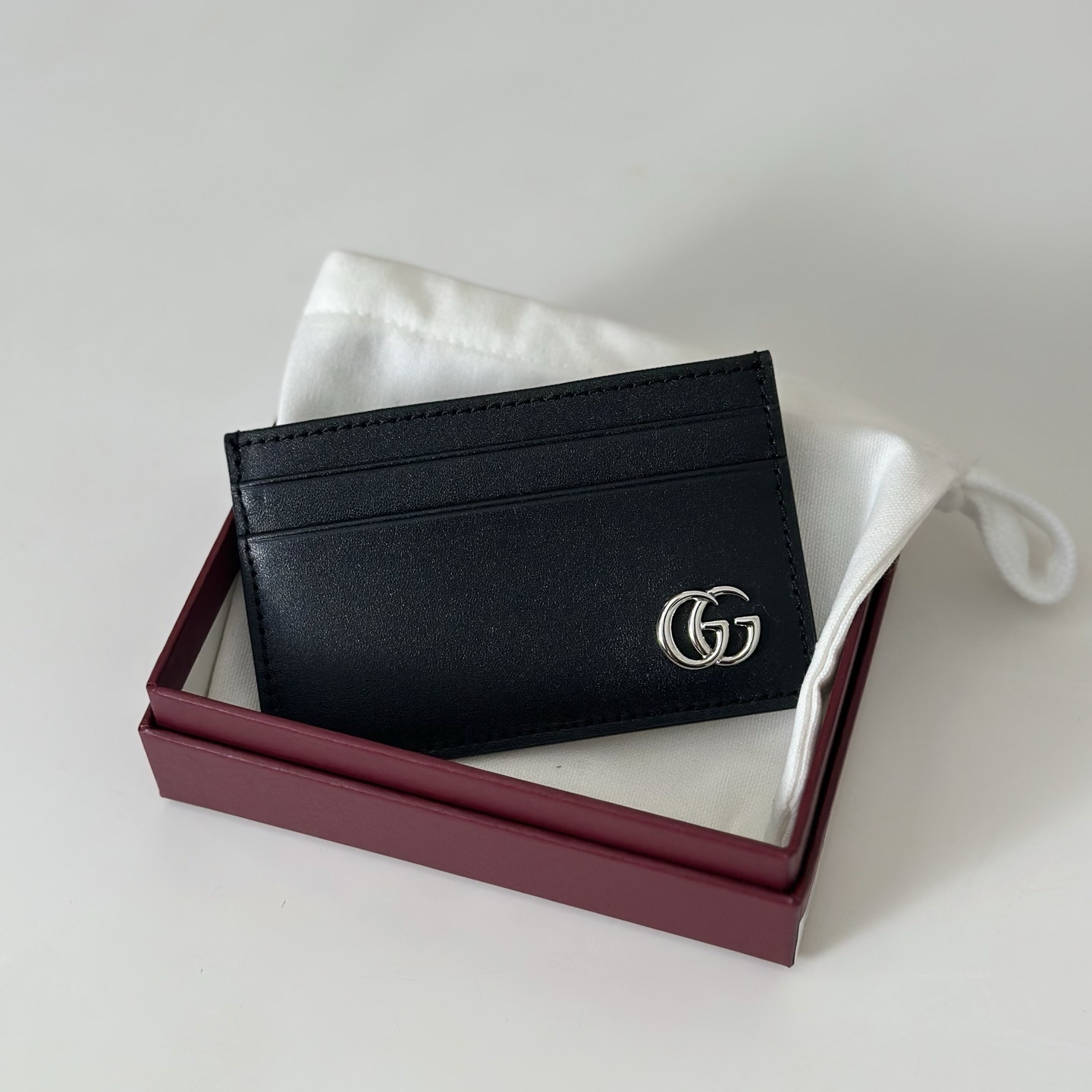 Gucci GG Marmont card case in black soft leather with a palladium-toned Double G logo