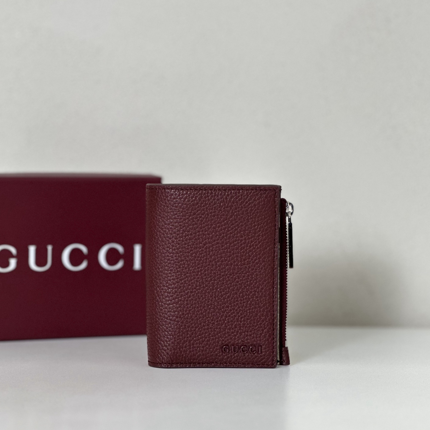 Gucci burgundy leather bifold wallet with a zipper