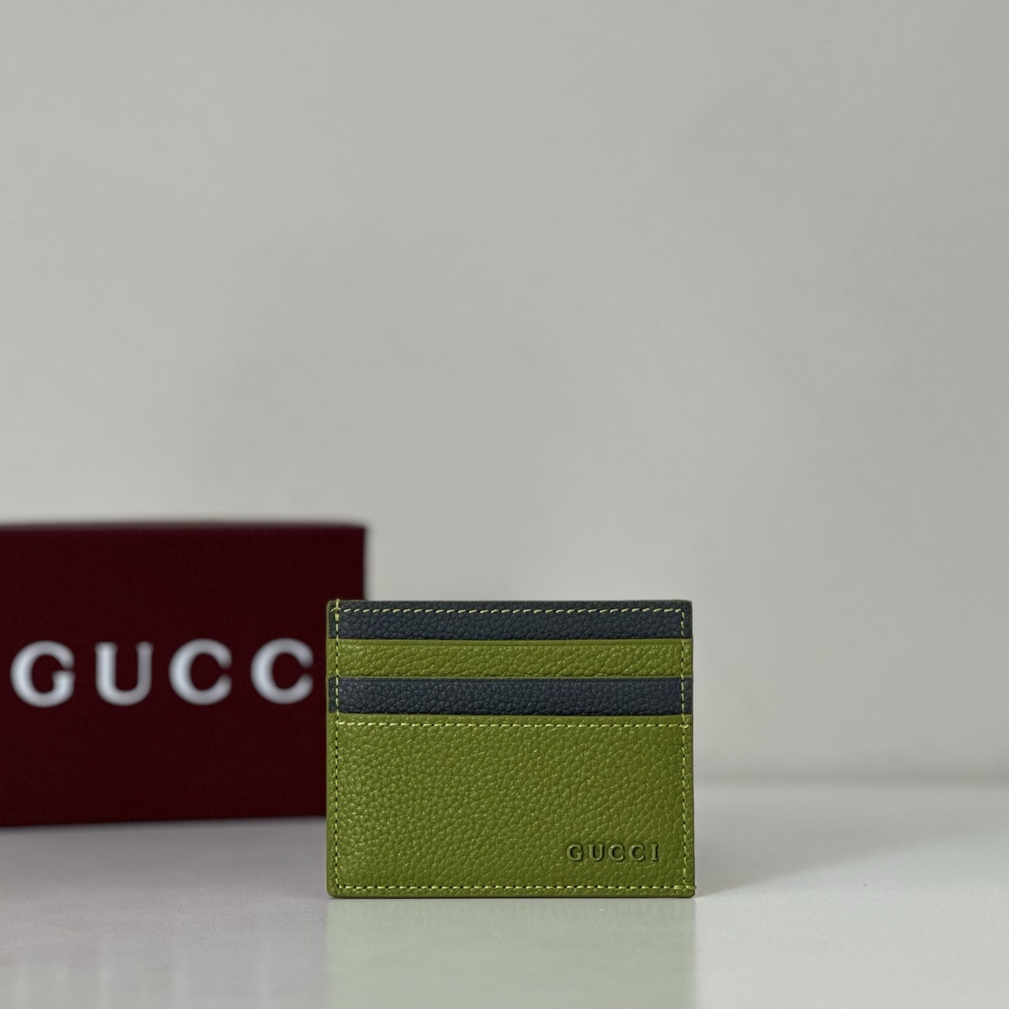 Gucci bi-color card case in a lime green and black leather finish