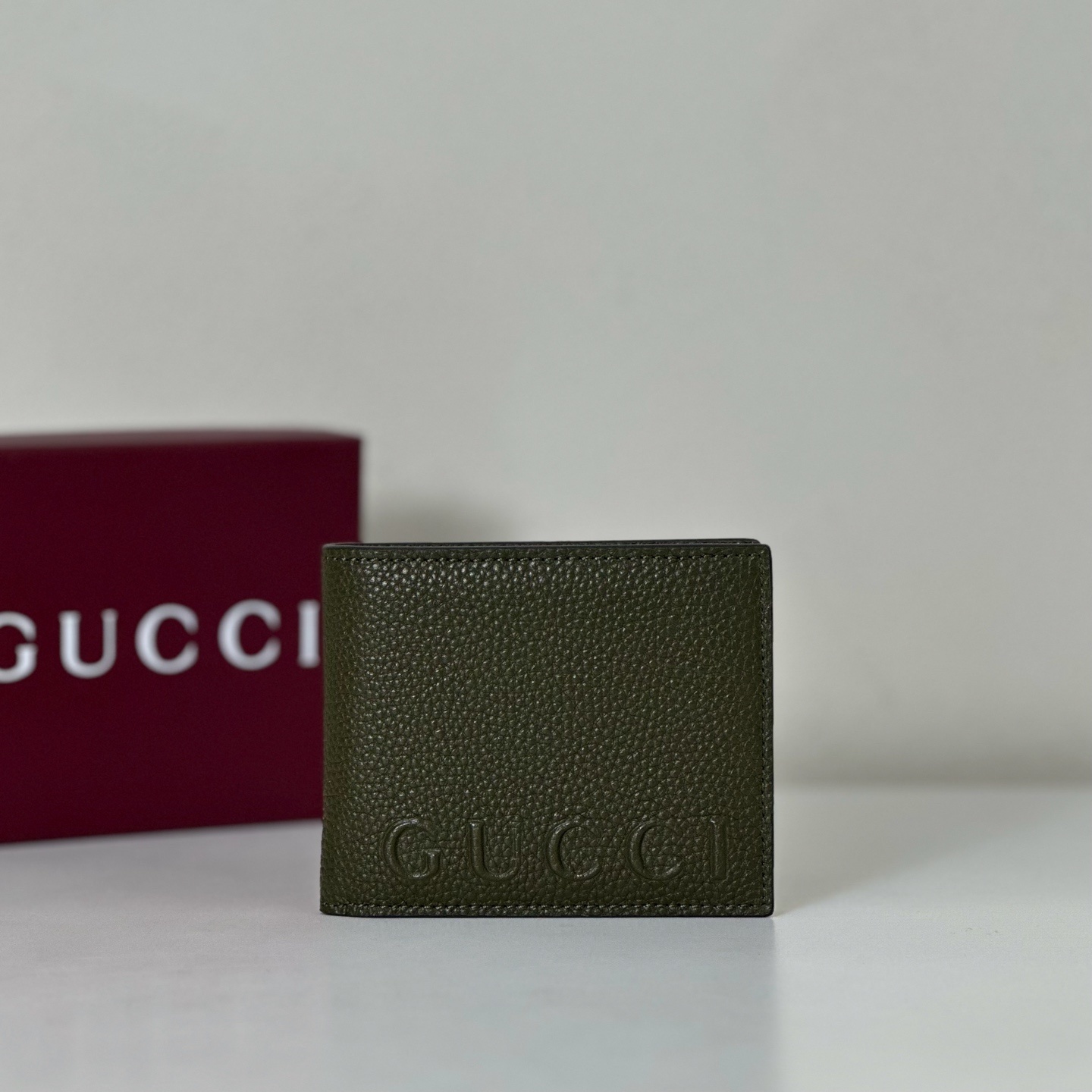 Gucci Jumbo GG bi-fold wallet in dark green leather