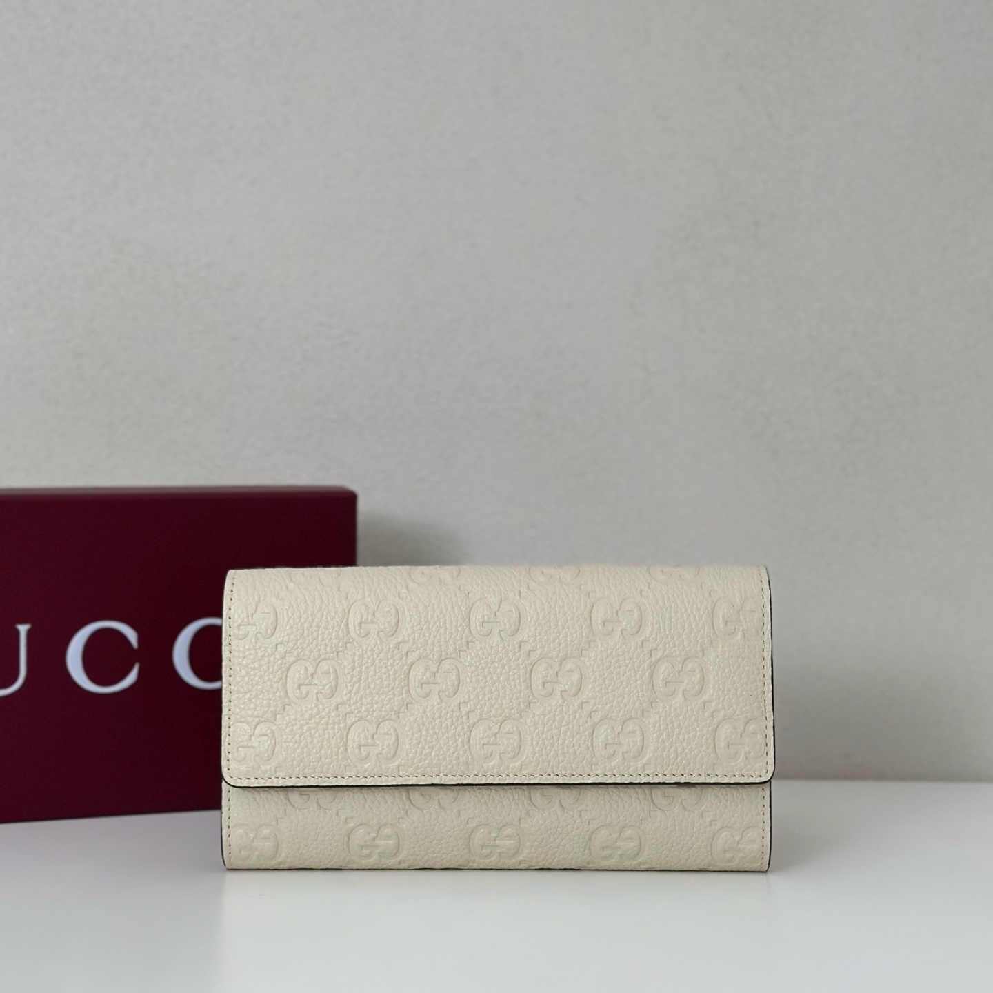 Gucci Guccissima Long Leather Wallet in an ivory or cream color
