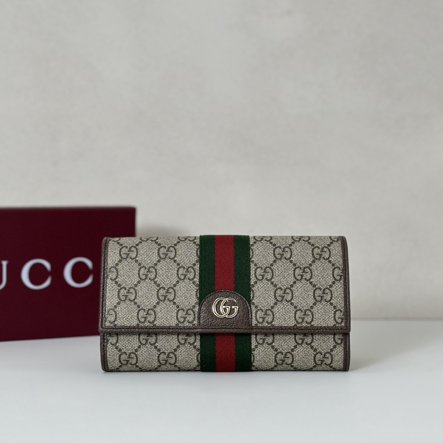 Gucci Ophidia GG Continental Wallet in beige GG Supreme canvas with brown leather trim and green and red Web stripe