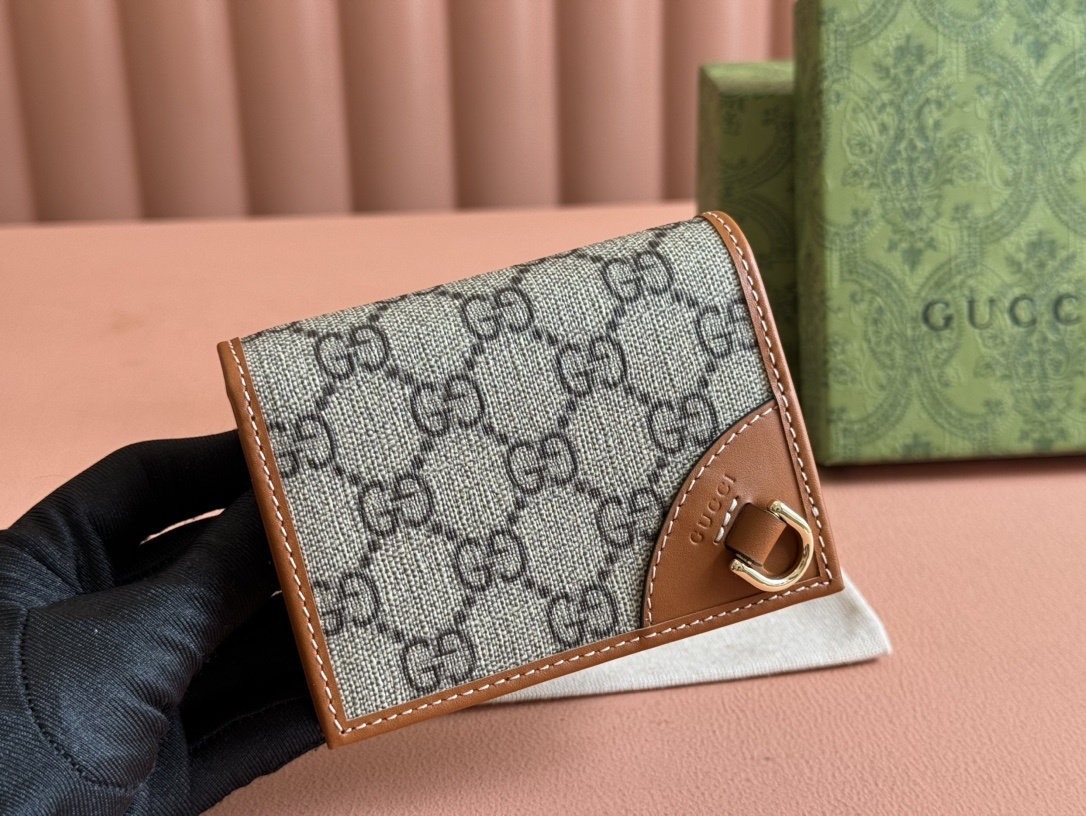 Gucci GG Emblem small wallet in beige and brown GG Monogram coated fabric with brown leather trim