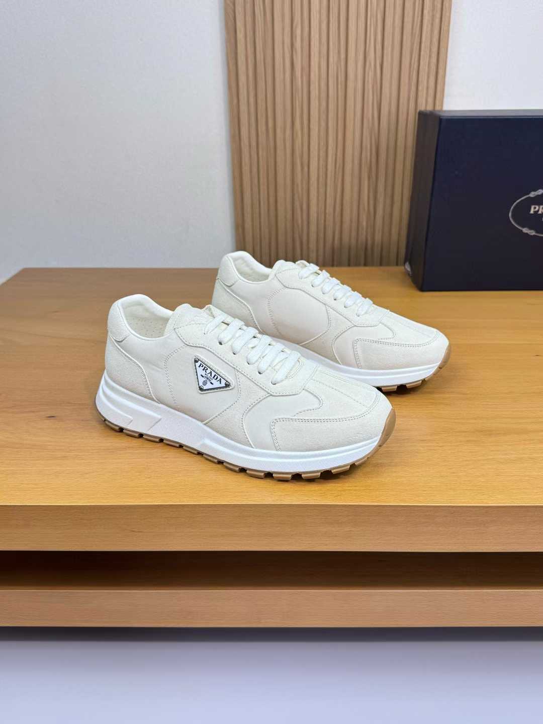 Prada Prax Re-Nylon and suede low-top sneakers in a white or ivory color